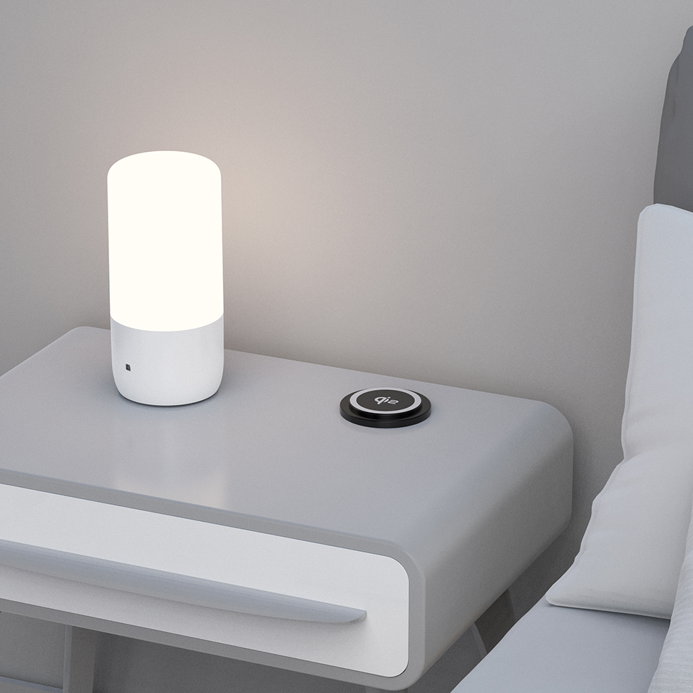 OME039-M embedded Qi2 wireless charger charging smartphone on office worksurface