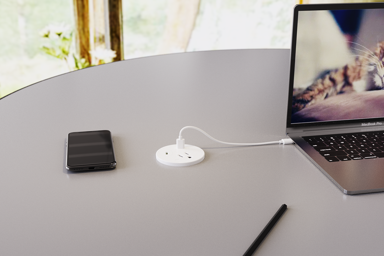 OME039.US-2C in worksurface charging two devices simultaneously via dual USB-C PD outputs
